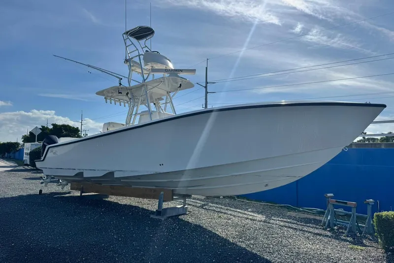 Slide: The Image of 2022 SeaVee 340Z boat on display under a clear blue sky. - 2