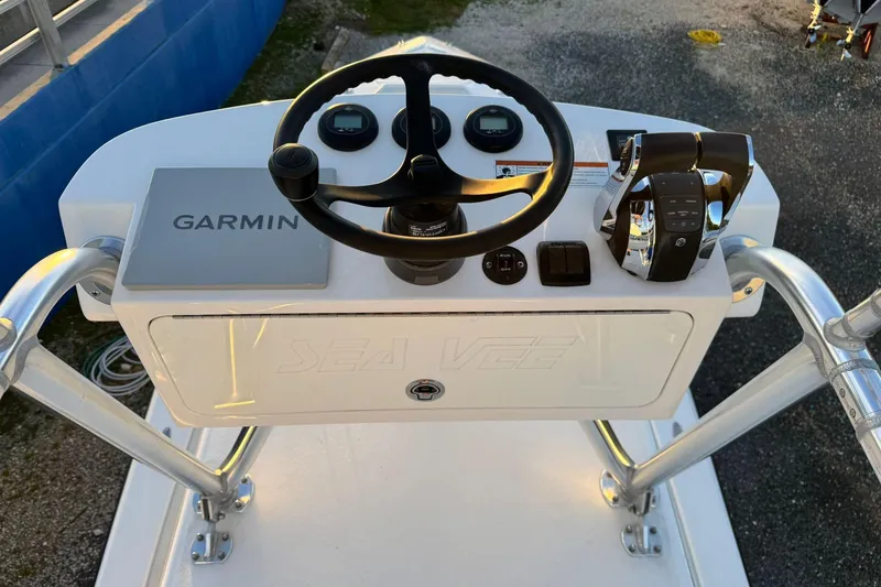 Slide: The Image of 2022 SeaVee 340Z boat console with Garmin navigation and steering wheel. - 20