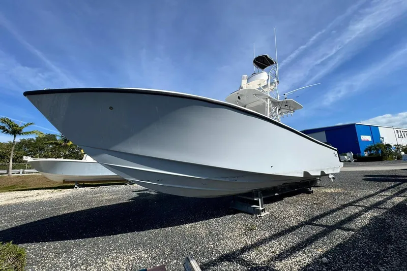 Slide: The Image of 2022 SeaVee 340Z boat on display under clear blue sky. - 3