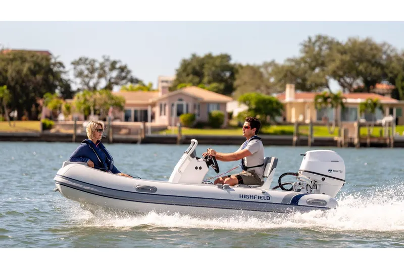 Slide: The Image of 2024 Highfield Classic 380 FCT boat on the water. - 8