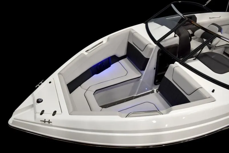 Slide: The Image of 2019 Rinker Q3 OB boat interior with white and black seating. - 5