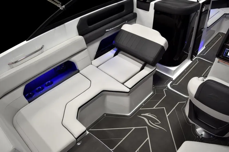 Slide: The Image of 2019 Rinker Q3 OB boat interior with modern seating and blue LED lighting. - 8