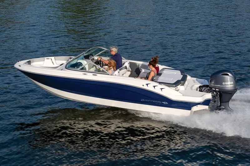The Image of 2026 Chaparral 19 SSi OB boat displayed in a showroom with sleek design. - 0