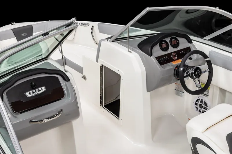 Slide: The Image of 2026 Chaparral 19 SSi OB boat interior with white and gray seating, Yamaha engine visible. - 5