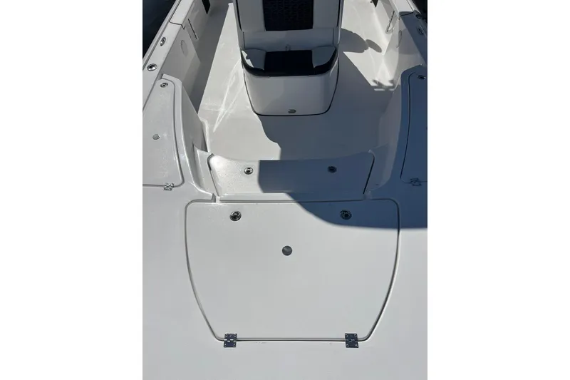 Slide: The Image of 2026 Tidewater 2410 Bay Max boat interior, featuring sleek white deck design. - 12