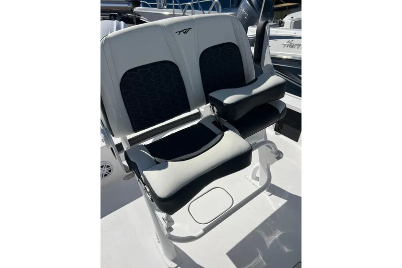 Slide: The Image of 2026 Tidewater 2410 Bay Max boat seats with black and white upholstery. - 13