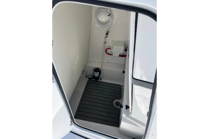 Slide: The Image of 2026 Tidewater 2410 Bay Max boat interior compartment with clean, modern design. - 18