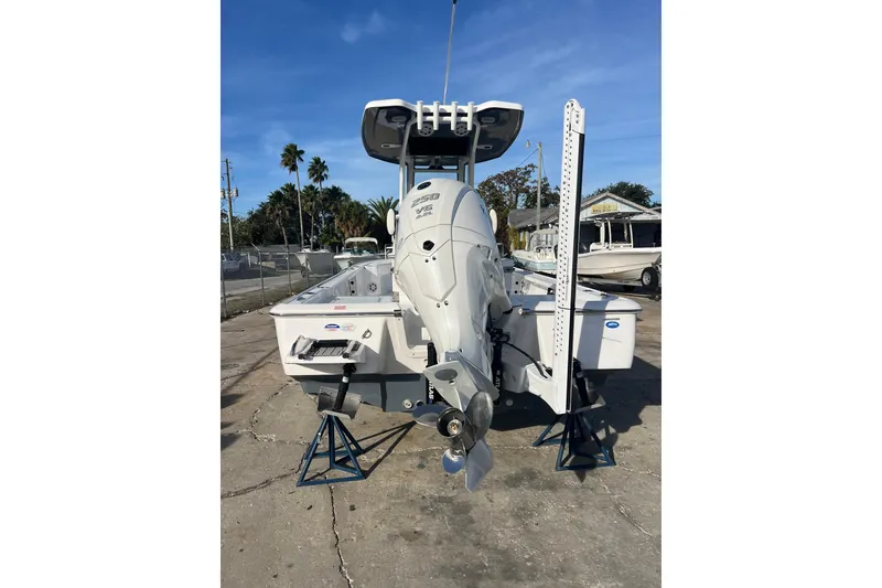 Slide: The Image of 2026 Tidewater 2410 Bay Max boat with powerful outboard motor on display. - 3