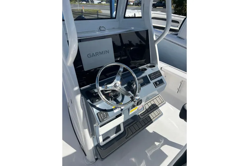 Slide: The Image of 2026 Tidewater 2410 Bay Max boat console with Garmin navigation system. - 7