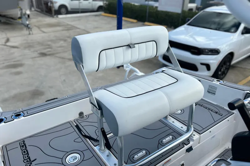 Slide: The Image of 2019 Yamaha Boats 190 FSH Sport helm seat with white upholstery and stainless steel frame. - 10
