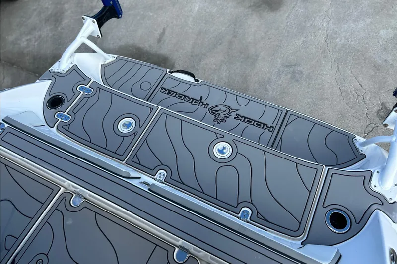 Slide: The Image of 2019 Yamaha Boats 190 FSH Sport deck with custom Hook Harder mat design. - 22