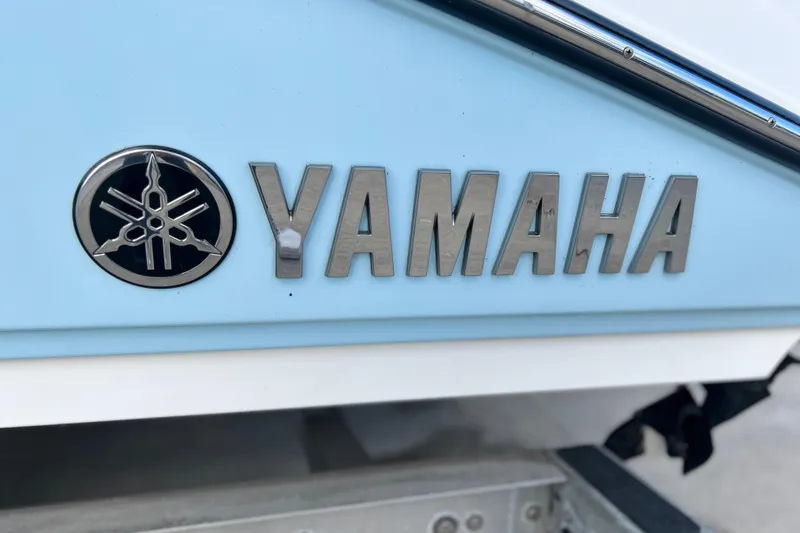 Slide: The Image of 2019 Yamaha Boats 190 FSH Sport logo on light blue hull. - 5