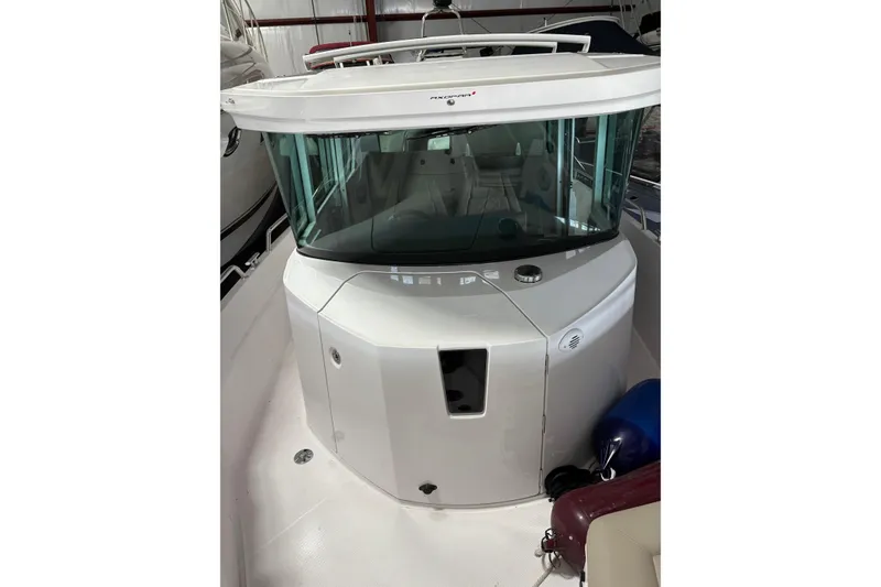 Slide: The Image of 2022 Axopar 28 CABIN boat with sleek design and modern features. - 12