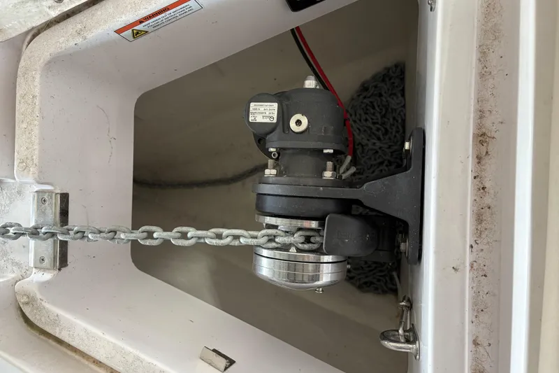Slide: The Image of Anchor chain mechanism in 2022 Axopar 28 CABIN boat compartment. - 16