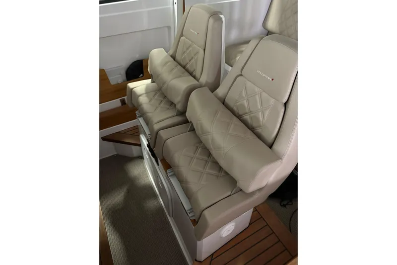 Slide: The Image of Luxurious seating in 2022 Axopar 28 CABIN boat with beige leather upholstery. - 22