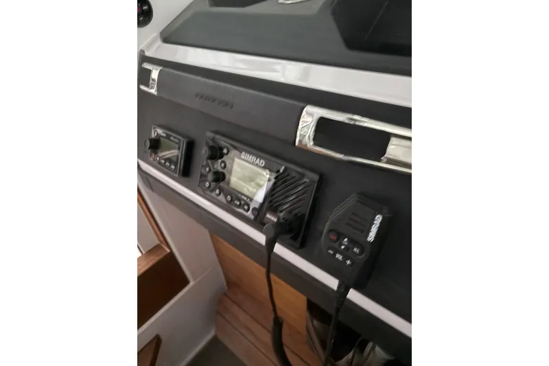 Slide: The Image of 2022 Axopar 28 CABIN dashboard with Simrad navigation equipment. - 25