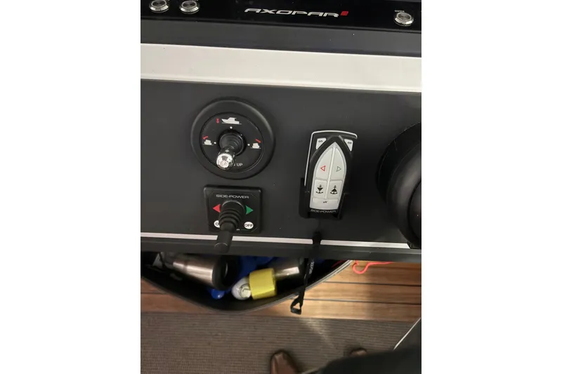 Slide: The Image of Control panel of 2022 Axopar 28 CABIN boat with joystick and side-power controls. - 31