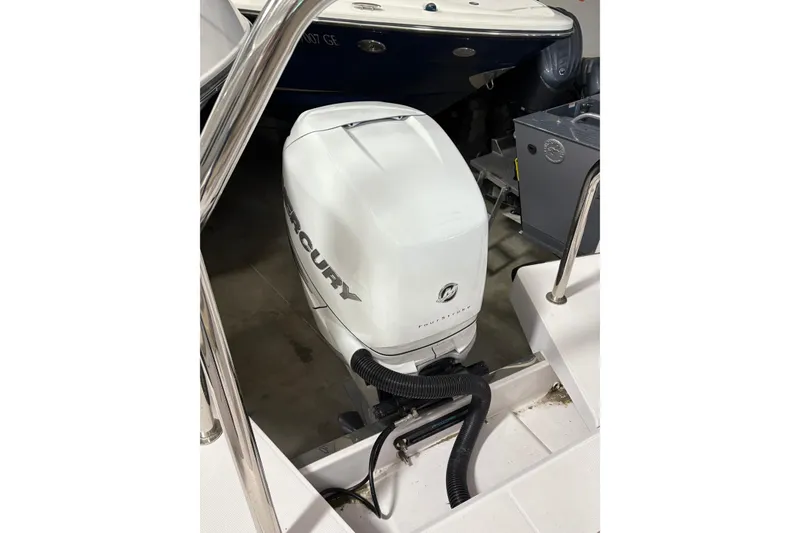 Slide: The Image of 2022 Axopar 28 CABIN with Mercury outboard engine in a showroom. - 42