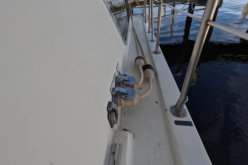 Slide: The Image of 1985 Chris-Craft 381 Catalina boat deck with railing and water connections. - 27