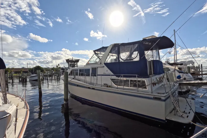 Slide: The Image of 1985 Chris-Craft 381 Catalina yacht docked under sunny skies. - 3