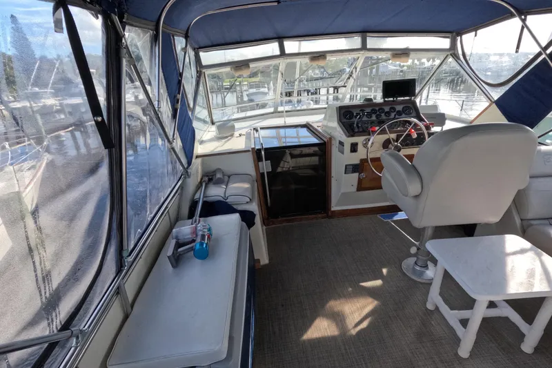 Slide: The Image of 1985 Chris-Craft 381 Catalina boat interior with helm, seating, and navigation equipment. - 30