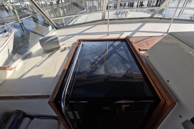 Slide: The Image of 1985 Chris-Craft 381 Catalina boat deck with glass hatch and marina view. - 37