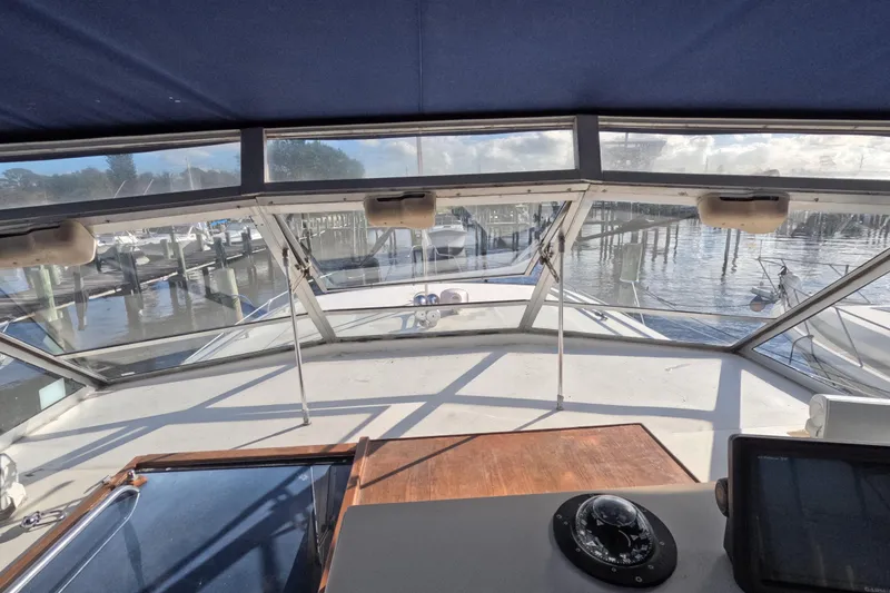 Slide: The Image of 1985 Chris-Craft 381 Catalina yacht interior view with marina background. - 38