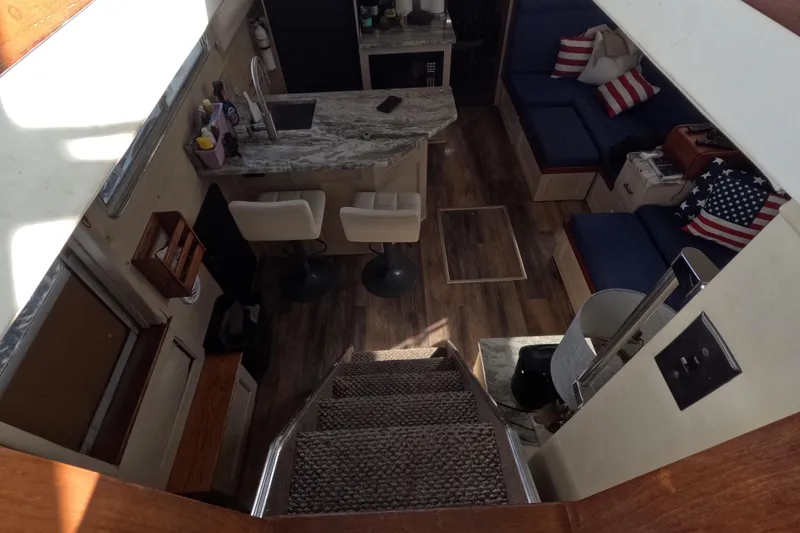 Slide: The Image of Interior of 1985 Chris-Craft 381 Catalina with modern kitchen and cozy seating area. - 39