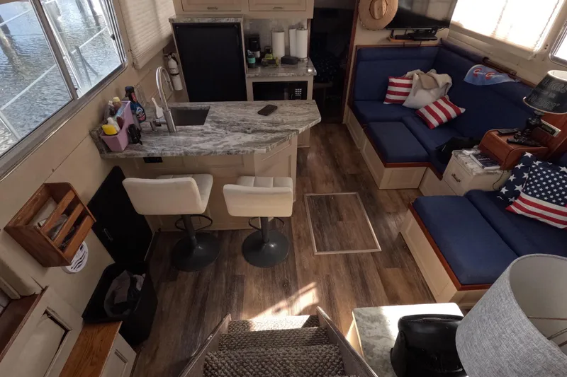 Slide: The Image of Interior of 1985 Chris-Craft 381 Catalina yacht with cozy seating and kitchenette. - 41