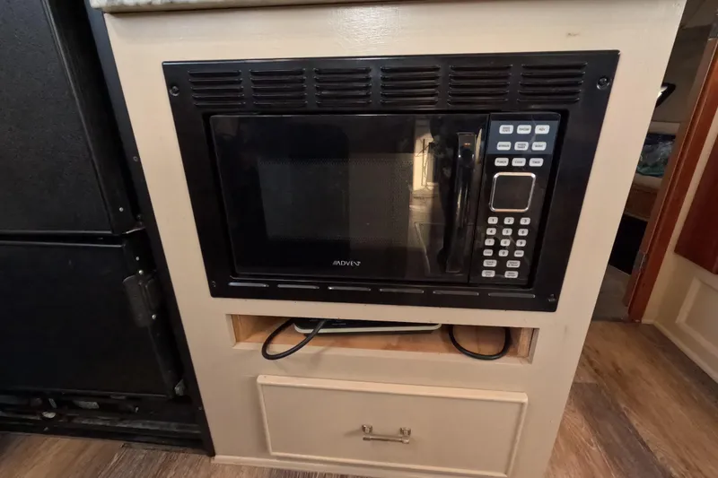 Slide: The Image of Built-in microwave in 1985 Chris-Craft 381 Catalina yacht kitchen area. - 46