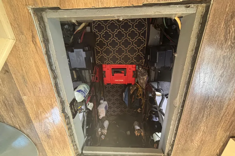 Slide: The Image of Engine compartment of 1985 Chris-Craft 381 Catalina with visible wiring and equipment. - 50