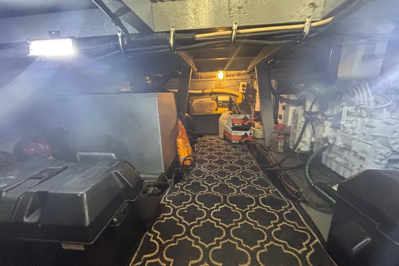 Slide: The Image of 1985 Chris-Craft 381 Catalina engine room with patterned carpet and mechanical components. - 51
