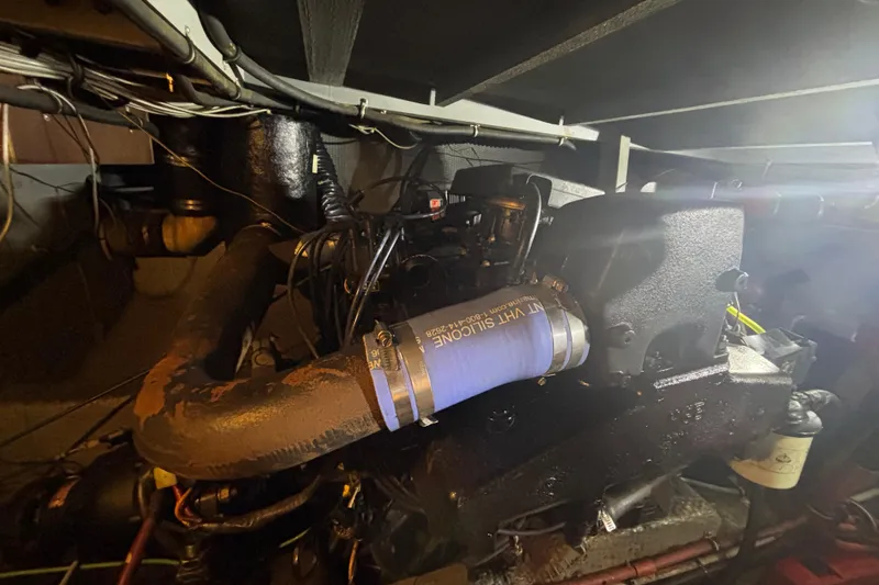 Slide: The Image of Engine room of 1985 Chris-Craft 381 Catalina with visible components and wiring. - 54