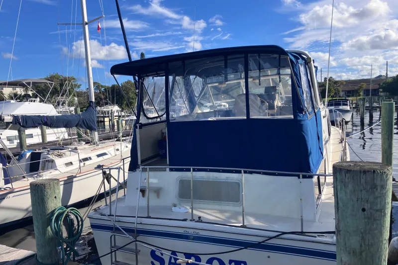 Slide: The Image of 1985 Chris-Craft 381 Catalina yacht docked at marina under blue sky. - 7