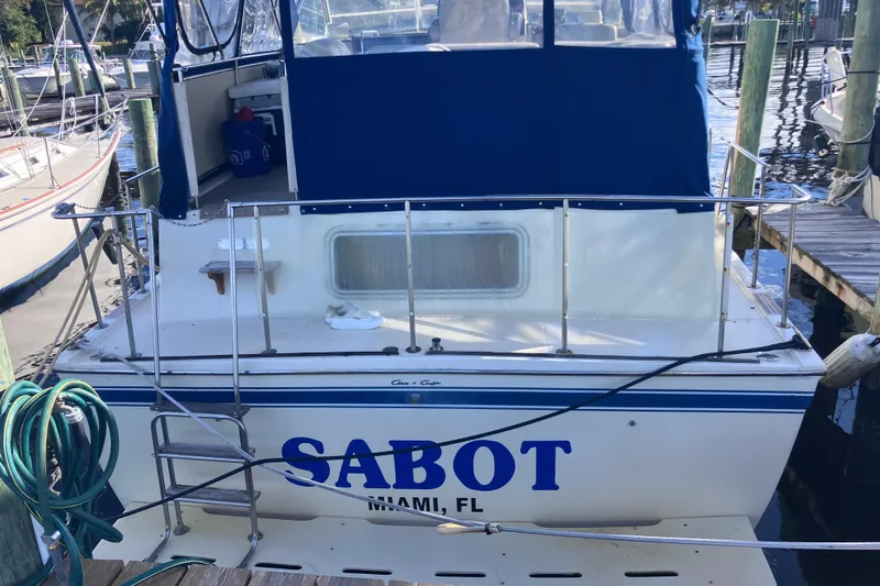 Slide: The Image of 1985 Chris-Craft 381 Catalina docked, featuring "SABOT" and "MIAMI, FL" on the stern. - 8