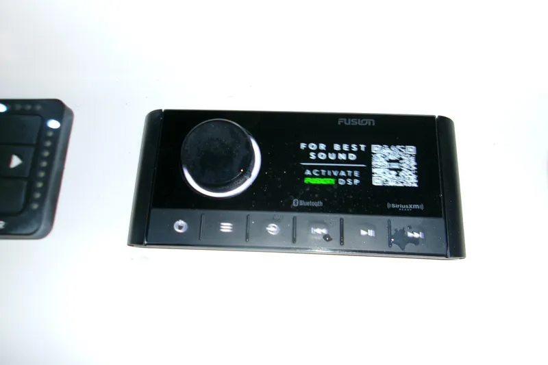 Slide: The Image of Garmin and Seakeeper controls on 2023 Sportsman Open 282 Center Console boat. - 13