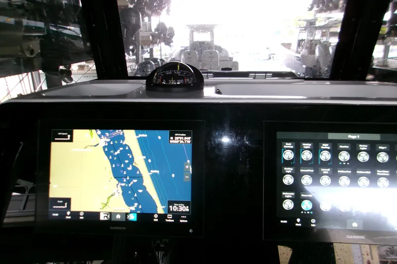Slide: The Image of 2023 Sportsman Open 282 Center Console controls with joystick and throttle levers. - 15
