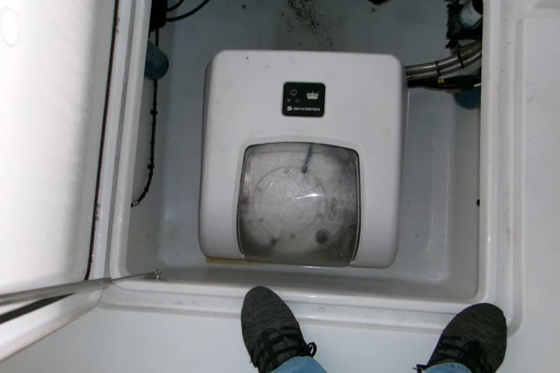 Slide: The Image of 2023 Sportsman Open 282 Center Console storage compartment with drawers and mesh pockets. - 18