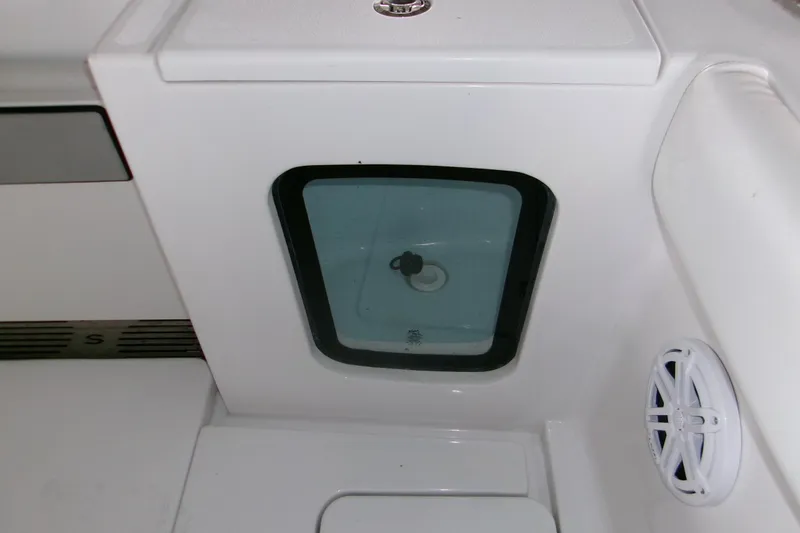 Slide: The Image of 2023 Sportsman Open 282 Center Console boat interior with seating and storage. - 6