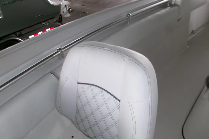 Slide: The Image of 2023 Sportsman Open 282 Center Console boat seats with diamond stitching detail. - 8