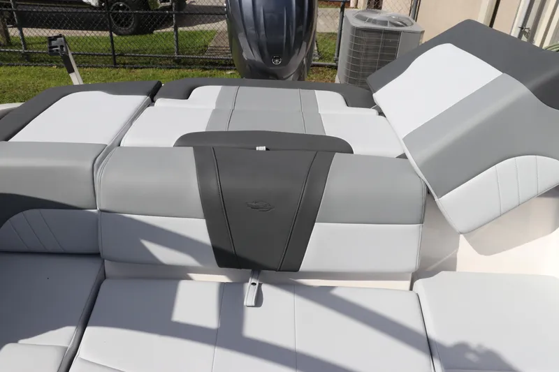 Slide: The Image of 2026 Chaparral 21 SSi OB boat interior with gray and white cushioned seating. - 13