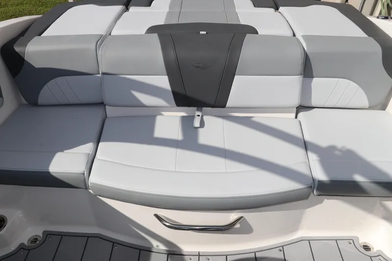 Slide: The Image of 2026 Chaparral 21 SSi OB boat seating, featuring sleek gray and white upholstery design. - 16