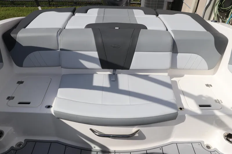 Slide: The Image of 2026 Chaparral 21 SSi OB boat interior with sleek gray and white seating design. - 17
