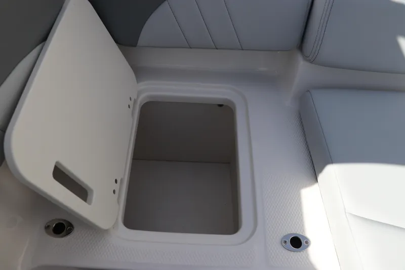 Slide: The Image of Open storage compartment on 2026 Chaparral 21 SSi OB boat interior. - 18