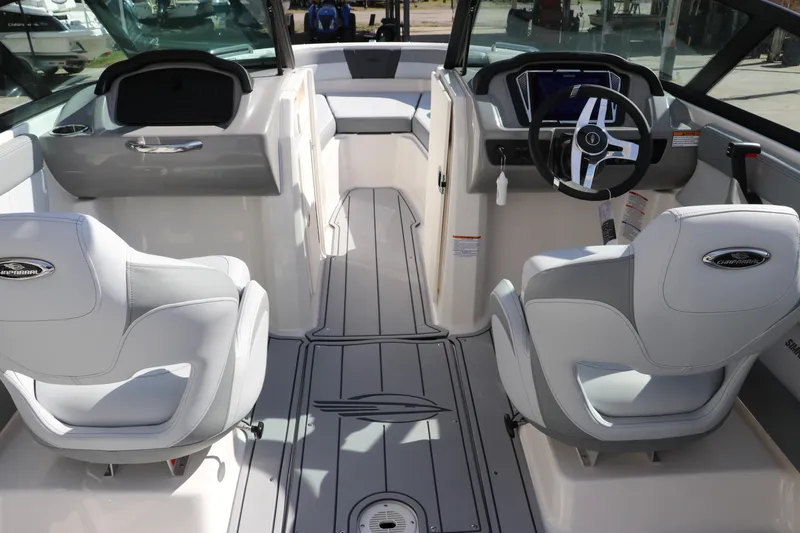 Slide: The Image of Interior of 2026 Chaparral 21 SSi OB boat with modern seating and dashboard. - 21