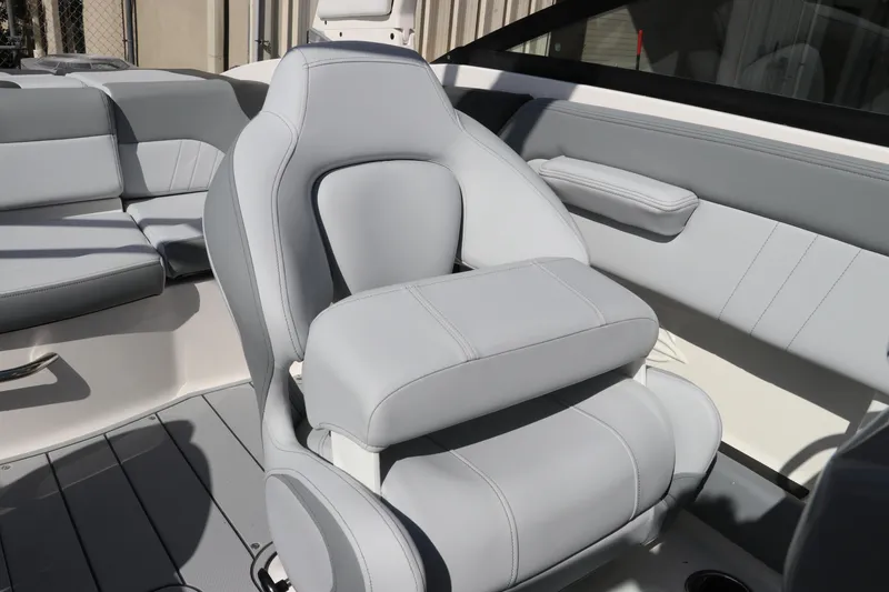 Slide: The Image of 2026 Chaparral 21 SSi OB boat interior with sleek gray seating and modern design. - 25