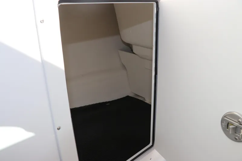 Slide: The Image of Interior storage compartment of 2026 Chaparral 21 SSi OB boat. - 30