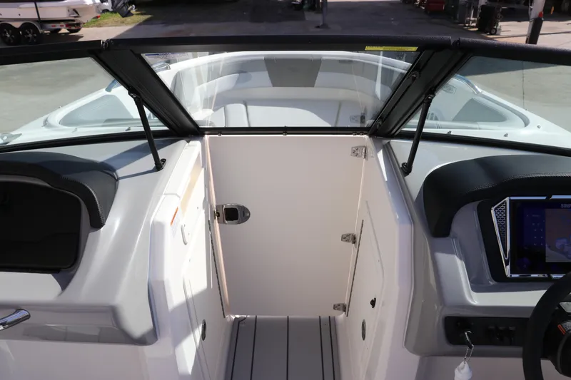 Slide: The Image of Interior view of 2026 Chaparral 21 SSi OB boat cockpit with modern dashboard. - 33