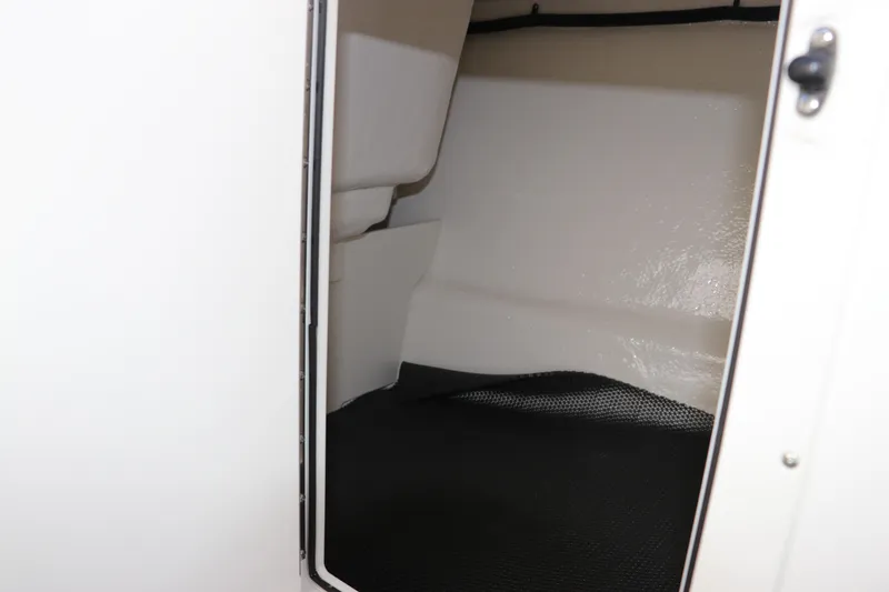 Slide: The Image of Interior cabin view of 2026 Chaparral 21 SSi OB boat, showcasing sleek design and spaciousness. - 35