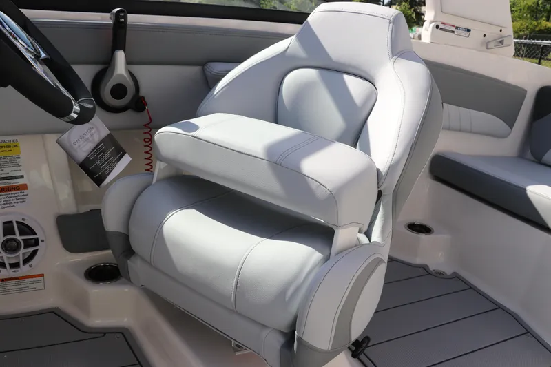 Slide: The Image of 2026 Chaparral 21 SSi OB boat interior with plush captain's chair and modern controls. - 36
